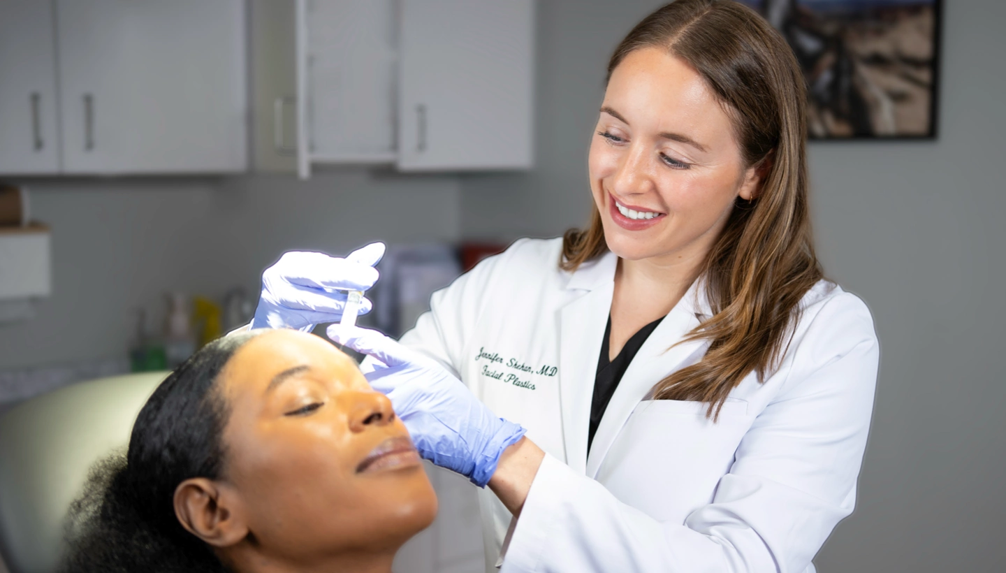 Dr Jenn Shehan giving an injection of botox or fillers